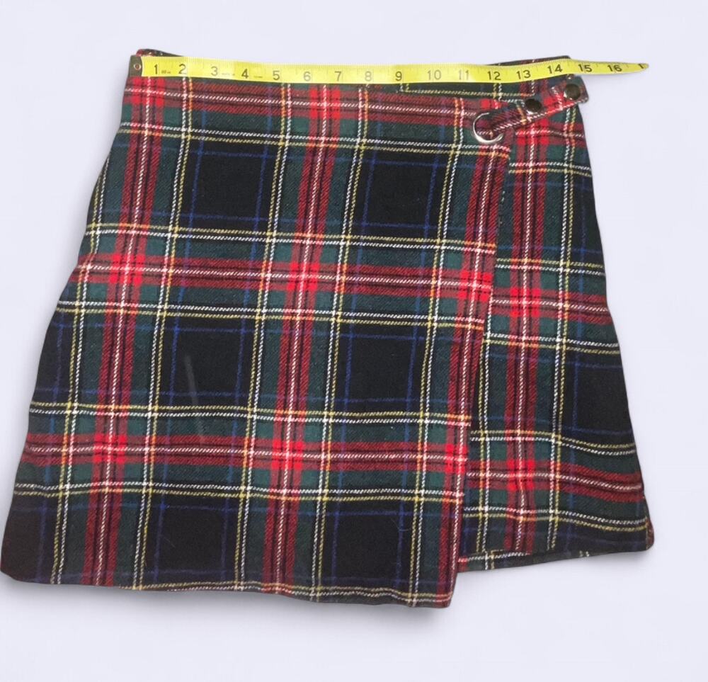 Red tartan plaid wrap mini skirt with asymmetrical wrap panel and silver grommet